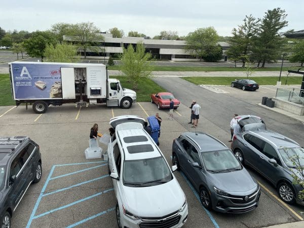 The Greystone Team helps clients unload documents to be securely shredded by AccuShred